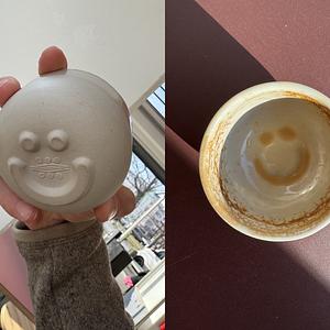 Awesome design ensuring you'll always see a smiley as you finish your coffee :)